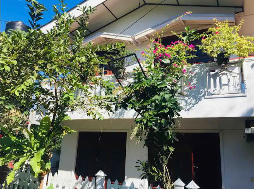 Bright living area with sofa and dining table